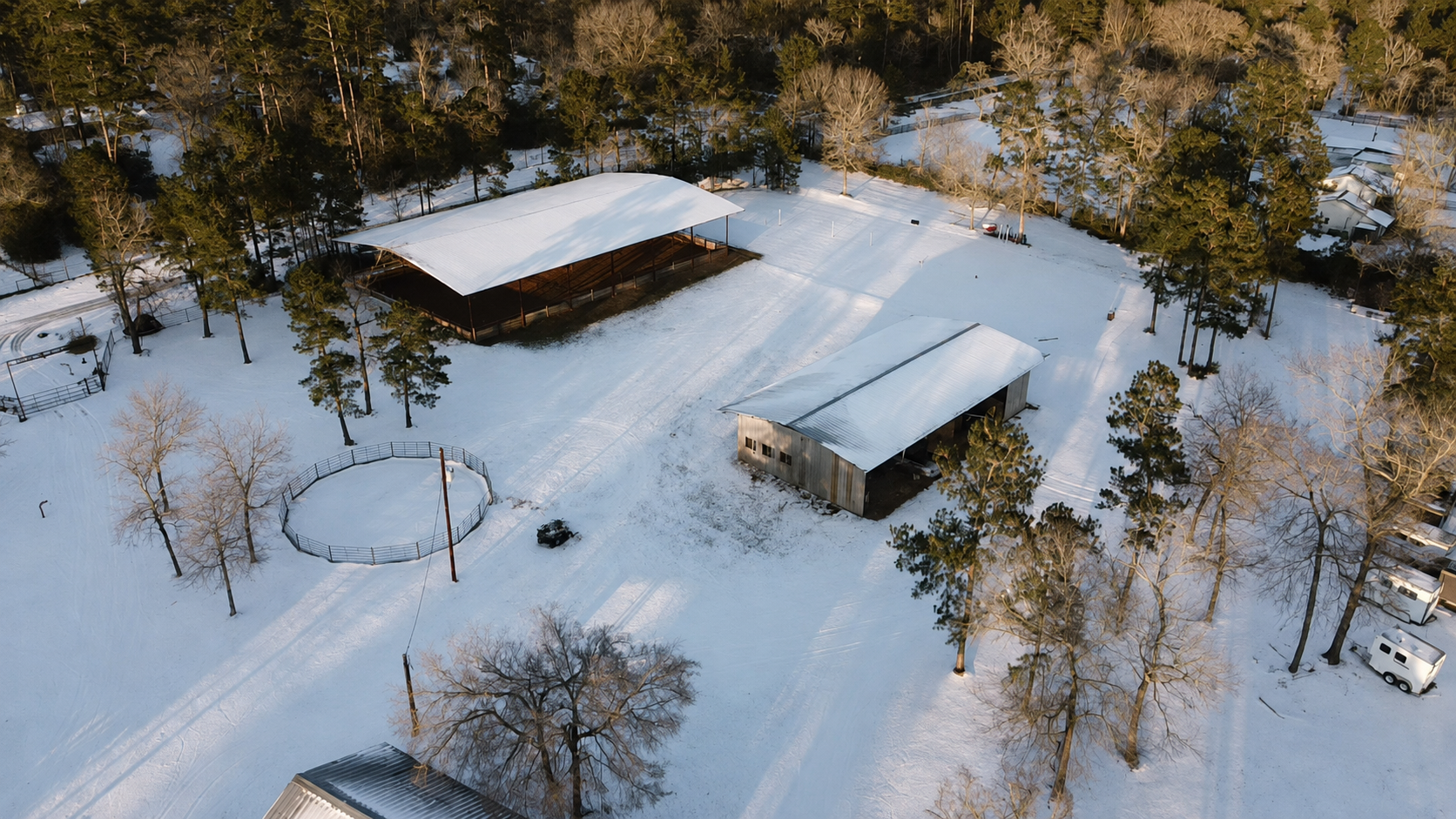 Aerial view of the property in snow