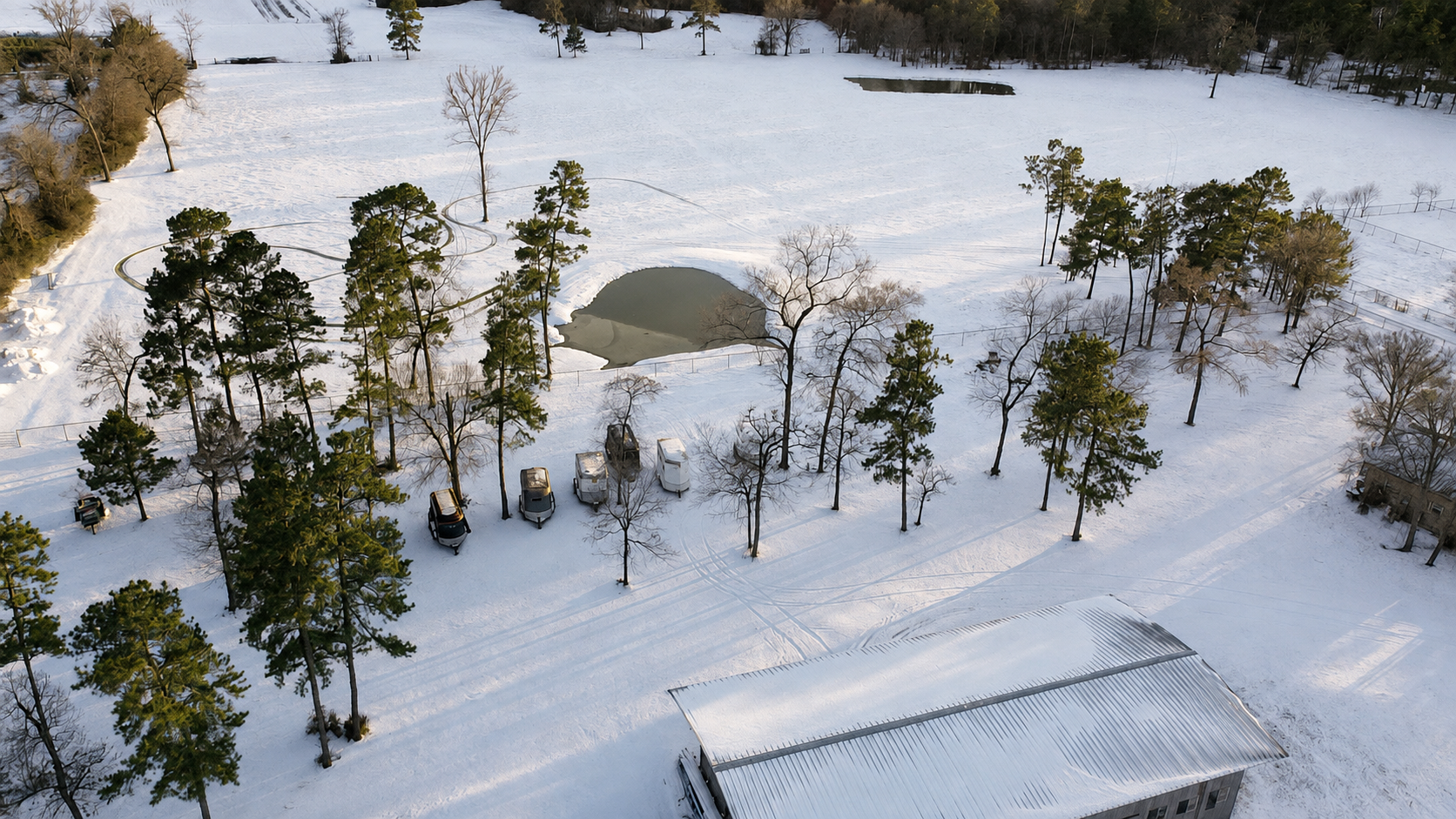 Looking down at the snow-covered farm